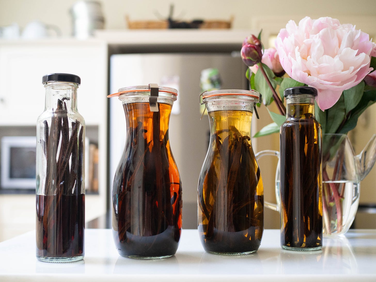 four bottles of homemade vanilla extract