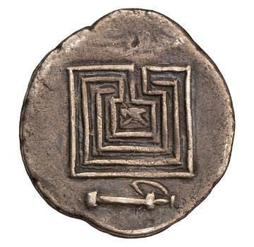 Ancient Greek silver coin showing the labyrinth design 