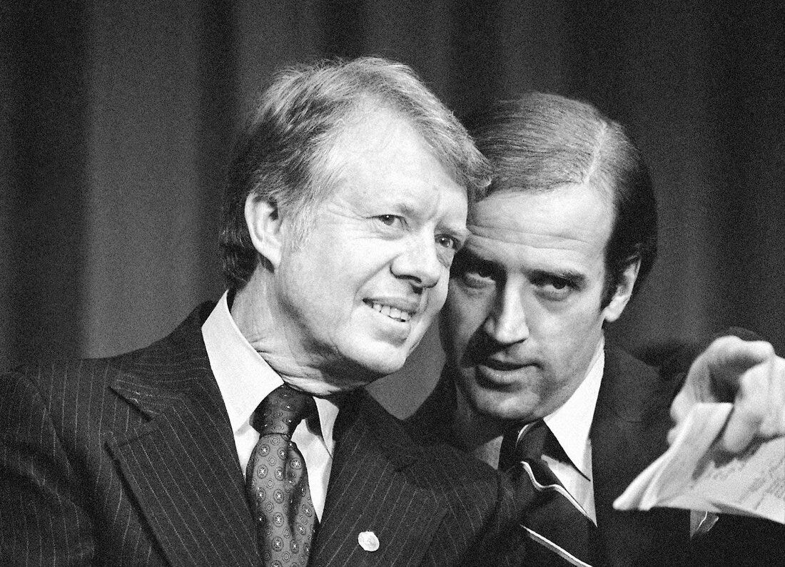 Feb. 20, 1978: President Jimmy Carter listens to Sen. Joe Biden as they wait to speak at a fundraiser in Wilmington, Del.