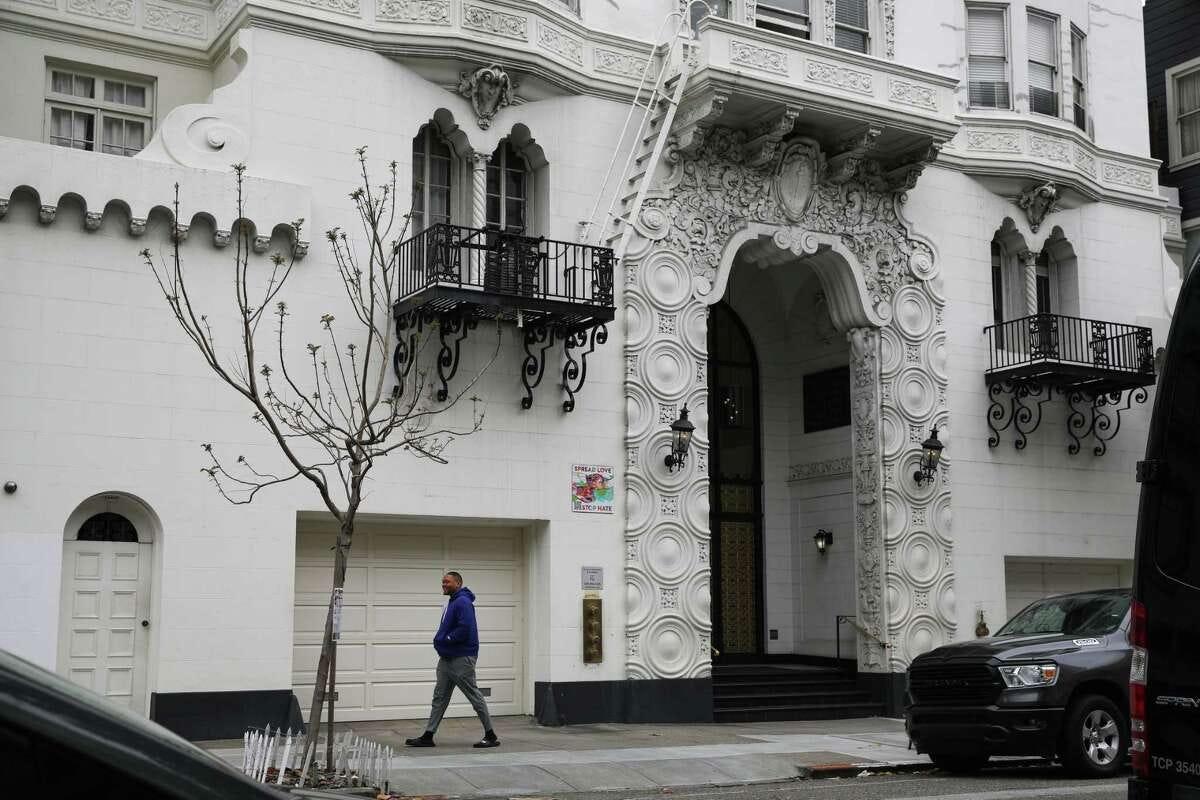 A pedestrian walks by a Veritas property at 645 Stockton St. in San Francisco in May.