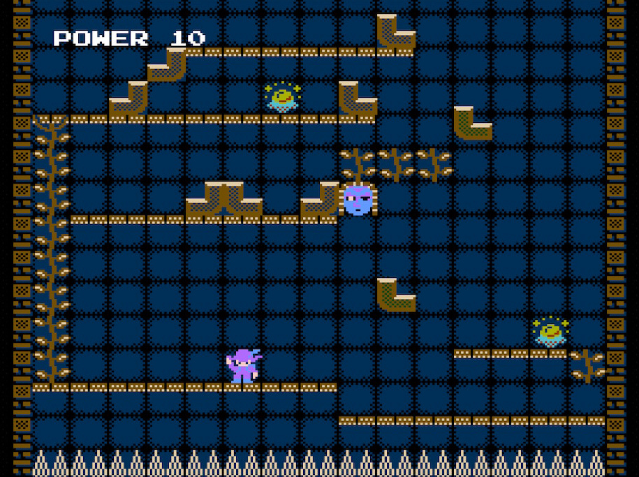 A screenshot of a stage from Mystery Tower, featuring Indy waving "hello" at the level's stage. Two crystal balls are seen in the stage, the entirety of which is above a bed of spikes. The door is currently unreachable and is also blocked off by a blue mask.