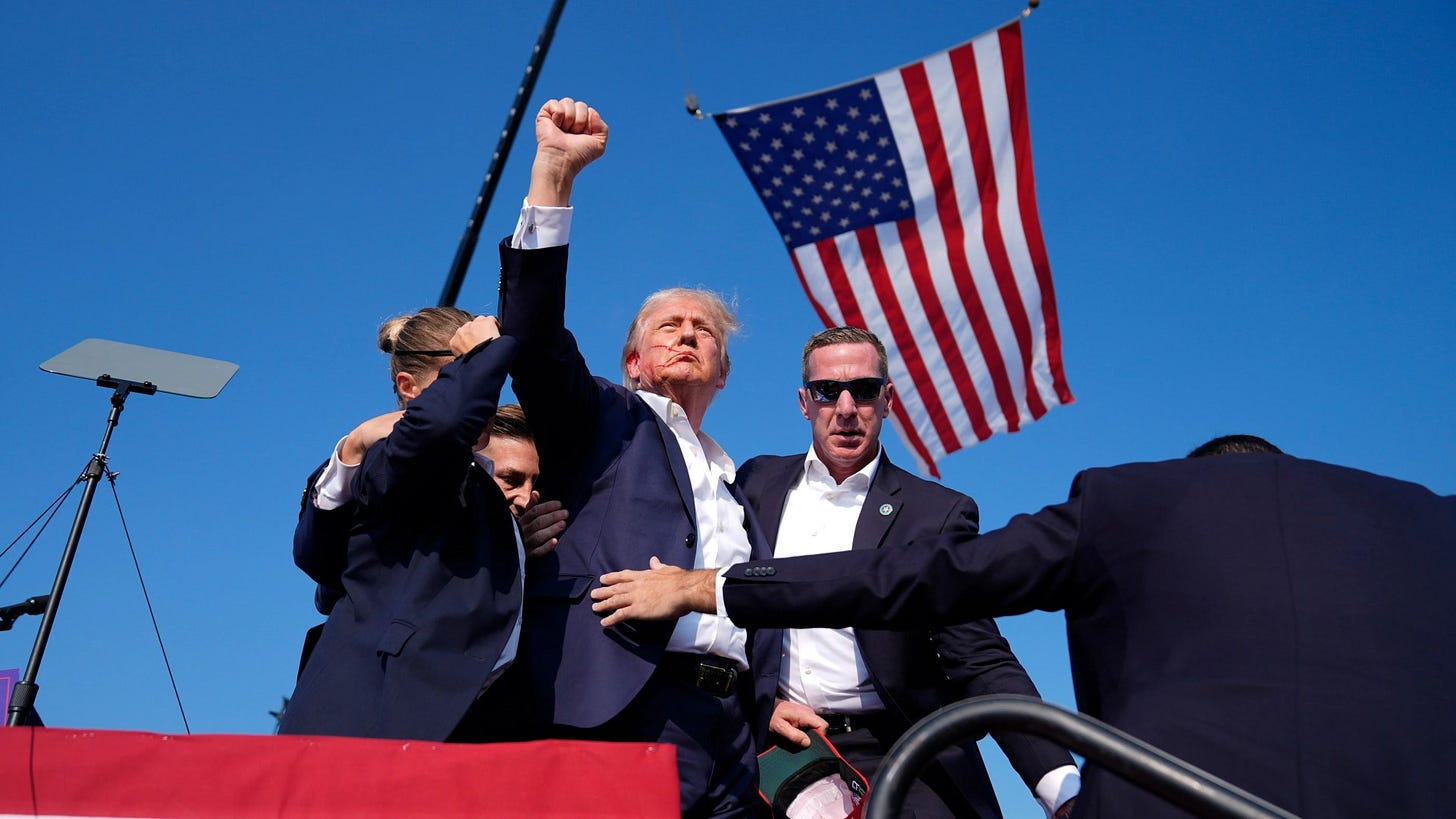 Iconic pic of bloodied Trump punching air after assassination bid will secure victory against ...