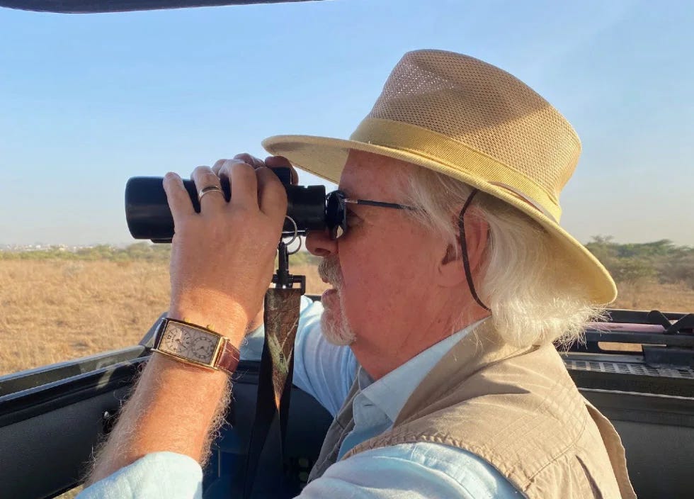 Picture of Mike Curry with Light Ministries, Inc. holding binoculars.