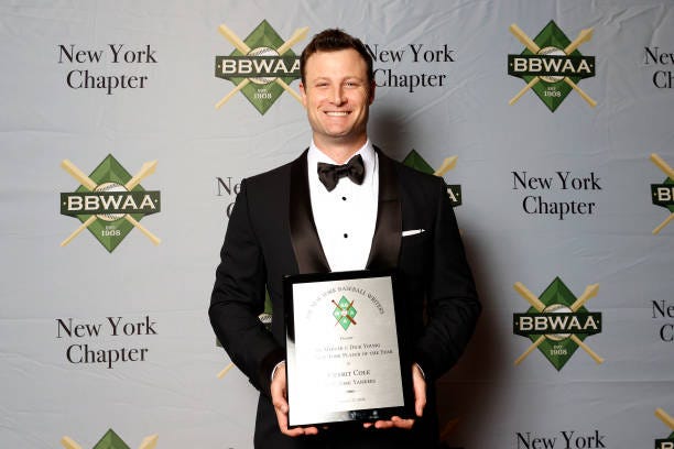 New York Yankees player Gerrit Cole poses with the Sid Mercer & Dick Young 2023 New York Player of the Year award during the 2024 BBWAA Awards Dinner...