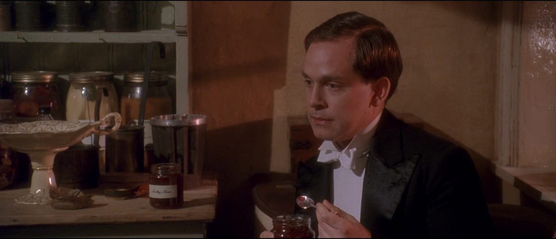 Tom Hollander eating jam in Gosford Park (with Sophie Thompson offscreen)