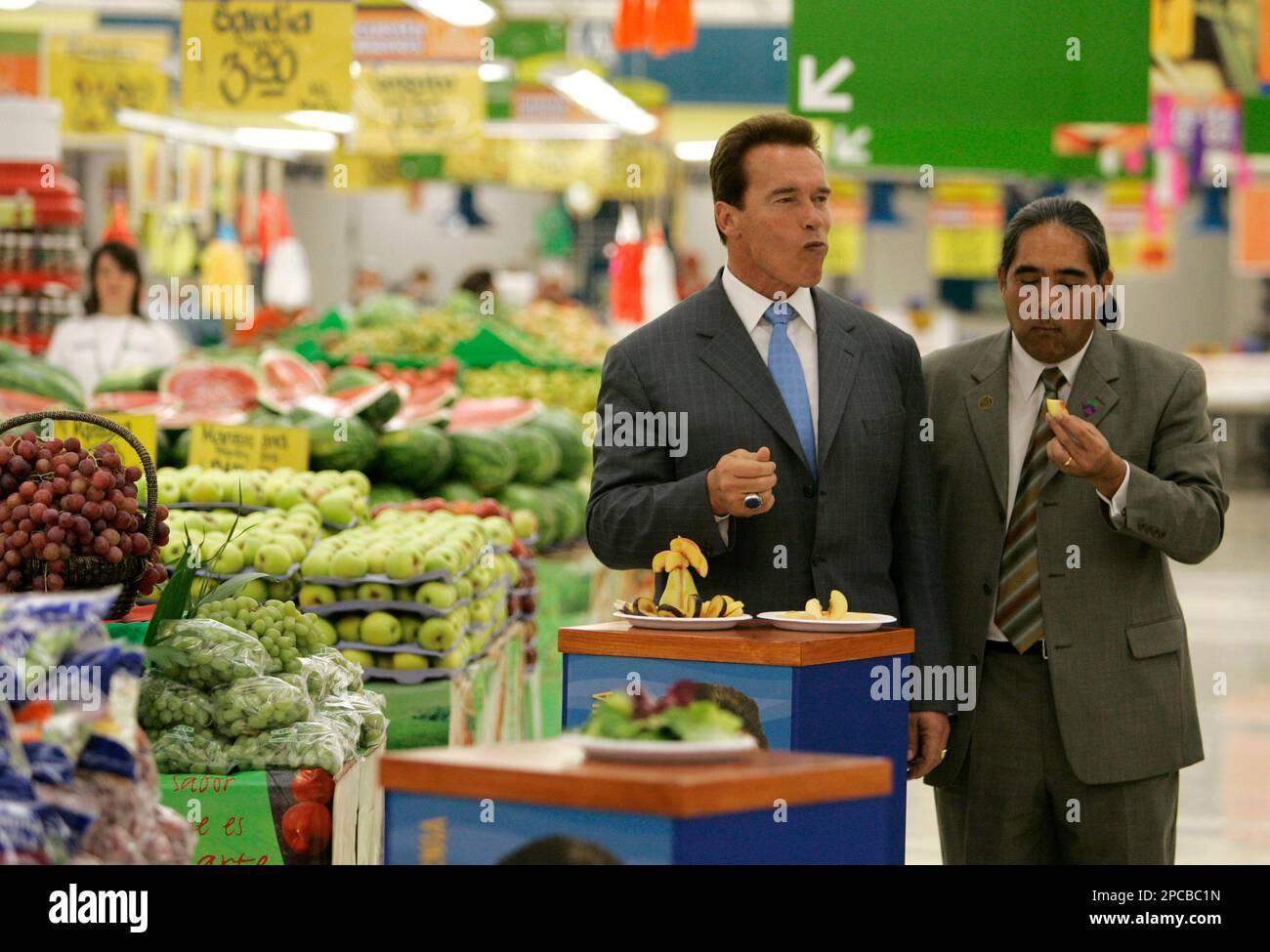 California Gov. Arnold Schwarzenegger samples fruit alongside California  Department of Food and Agriculture Director secretary A.G. Kawamura during  a visit to a supermarket to promote California products in Mexico City,  Thursday, Nov.