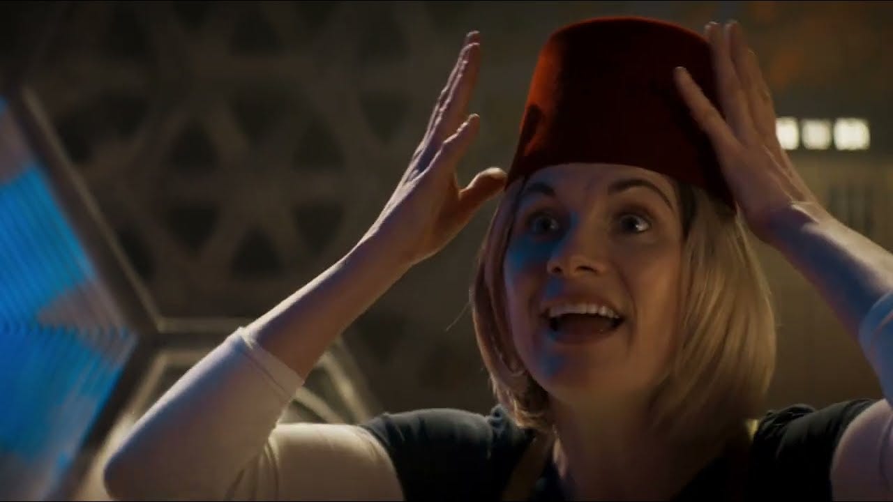 This image shows the Thirteenth Doctor (played by Jodie Whittaker) happily donning a red fez in "Kerblam!" (Doctor Who Series 11's seventh episode). This image shows the Thirteenth Doctor (played by Jodie Whittaker) happily donning a red fez in "Kerblam!" (Doctor Who Series 11's seventh episode).