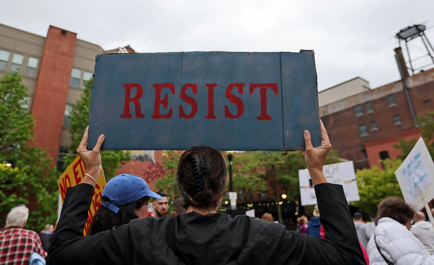 Protestors gather at Market Square to protest local and national government during a May Day protest.