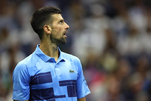 Novak Djokovic of Serbia looks on after a point against Alexei Popyrin of Australia during their Men's Singles Third Round match on Day Five of the...