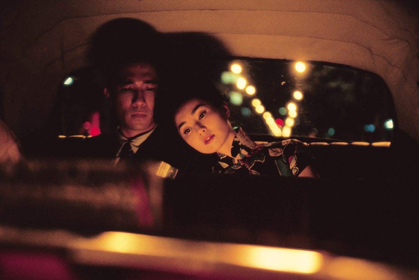 Tony Leung Chiu-wai (left) stars as Chow Mo-wan and Maggie Cheung (right) stars as Su Li-zhen in "In the Mood for Love" (2000), directed by Wong Kar-wai.