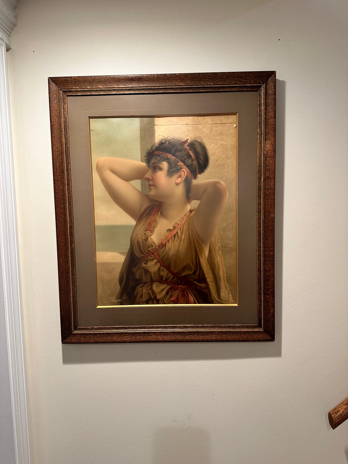 a large framed print of a beautiful woman in Roman garb