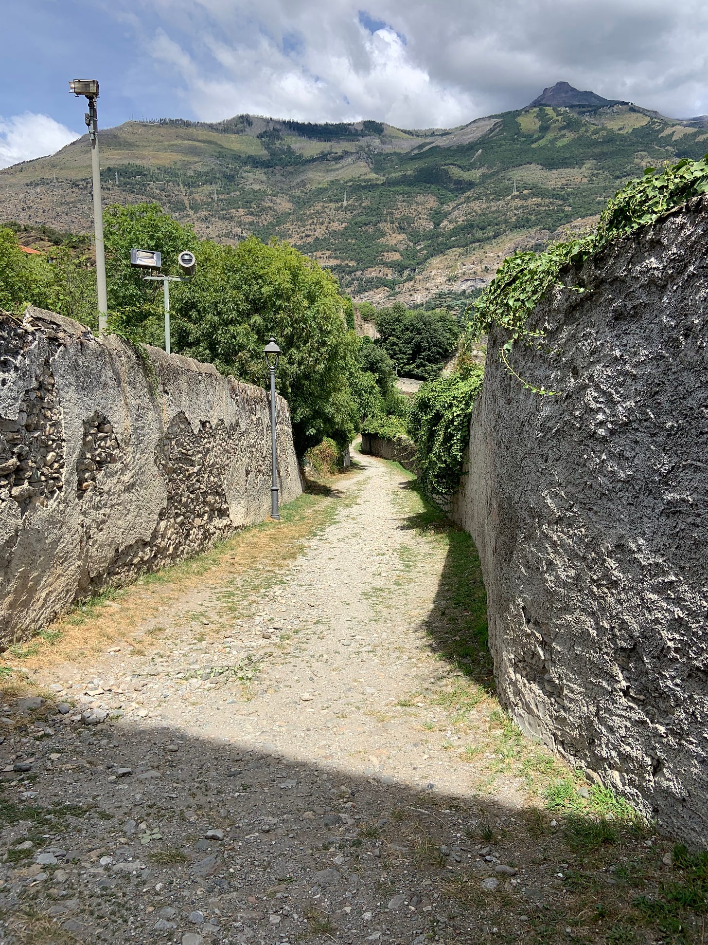 Gladiator Fights in Susa. Little towns in Italy often contain unexpected treasures. They preserve the antique artifacts better than the famous tourist attractions. I want to show you the amphitheater of Susa today. 