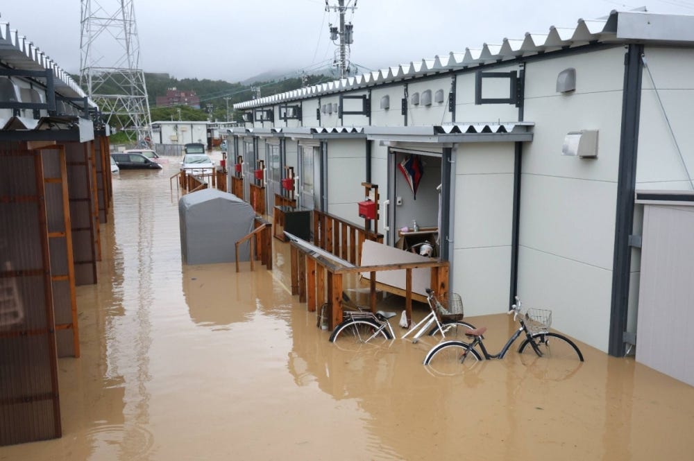 A temporary housing unit in Wajima for evacuees of the January earthquake is seen submerged in water on Sunday.