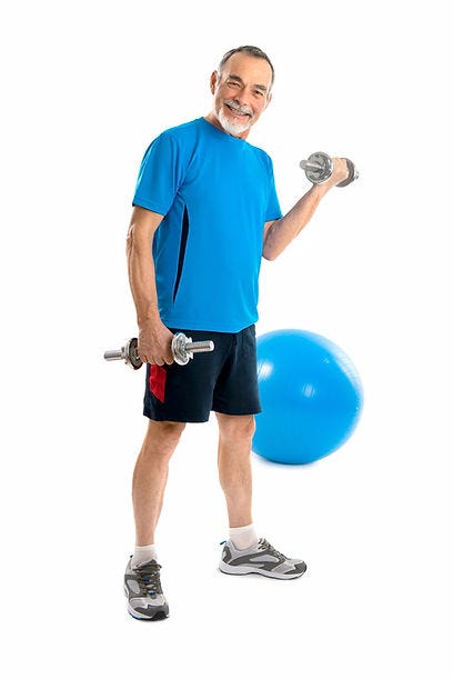 senior lifting weights with a fit ball in the background