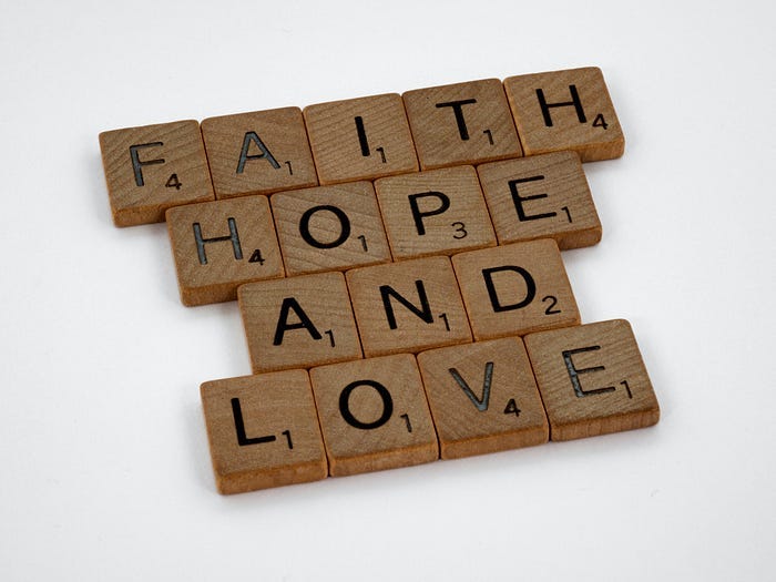Scrabble blocks spelling out the words, “Faith, hope, and love.” Scrabble blocks spelling out the words, “Faith, hope, and love.”