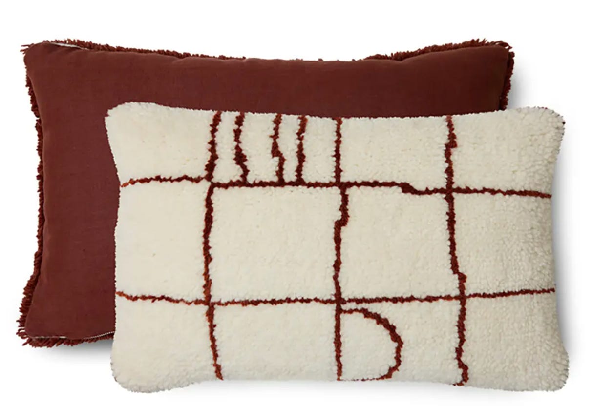 chunky knit cushion with rich brown on one side and cream on the other