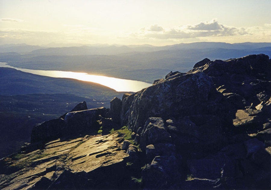View from the summit of Scotland’s Mount Schiehallion looking over loch Rannoch into the setting sun, one of the alleged locations of the legendary Mount Heredom. (CC BY-SA 2.0)