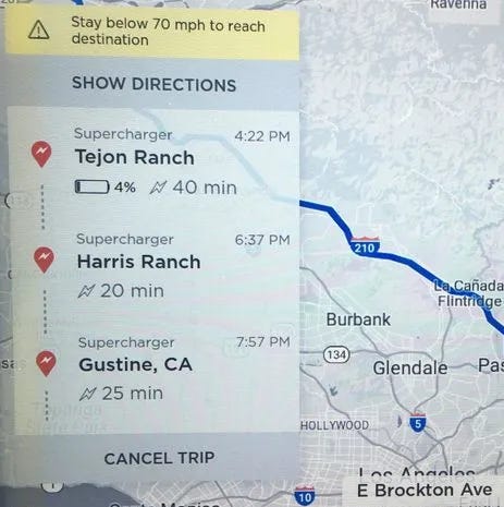 An image of the Tesla navigation UI with a warning that says "Stay below 70 mph to reach destination"