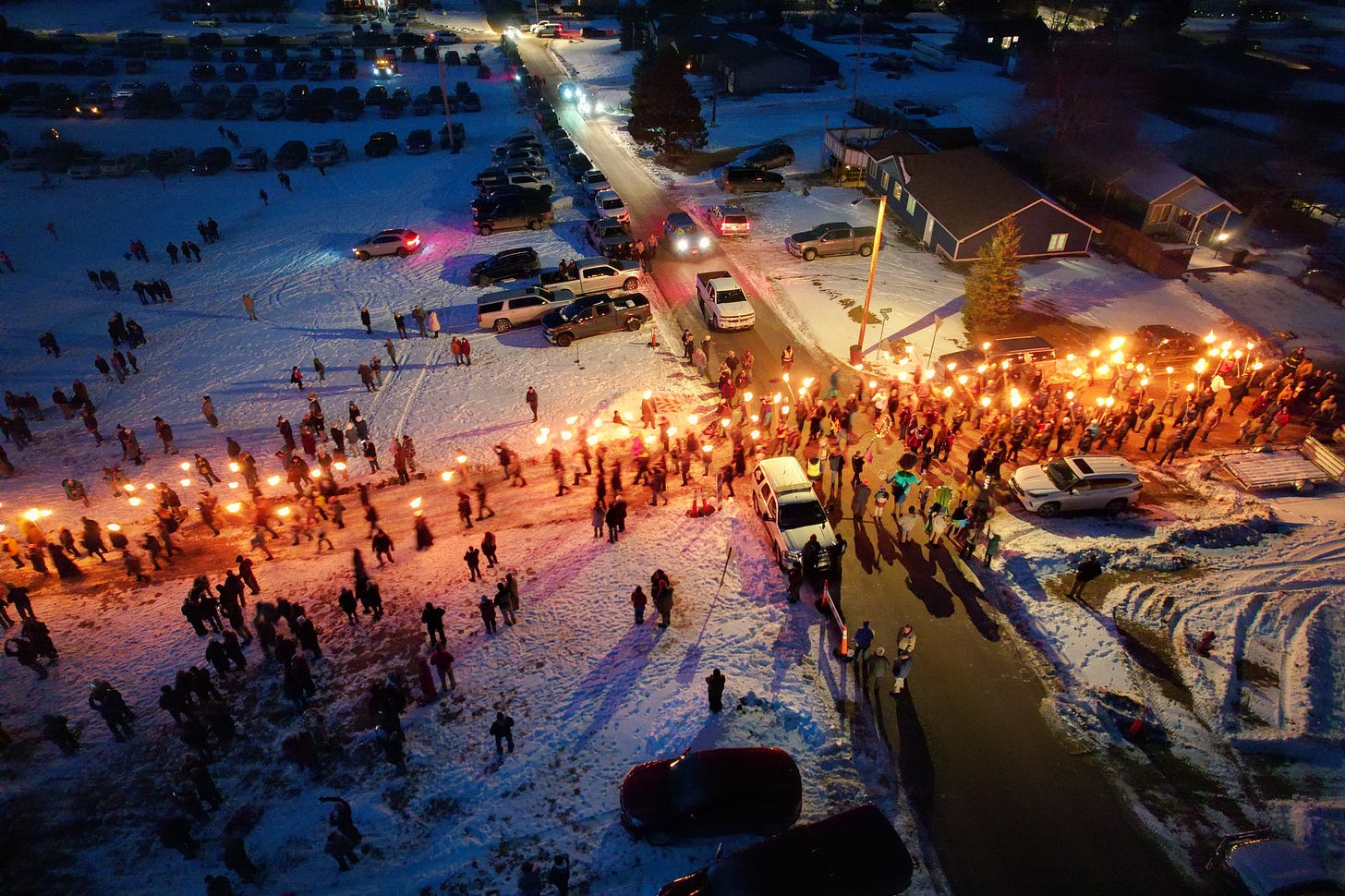 May be an image of 1 person, fire, crowd and arctic