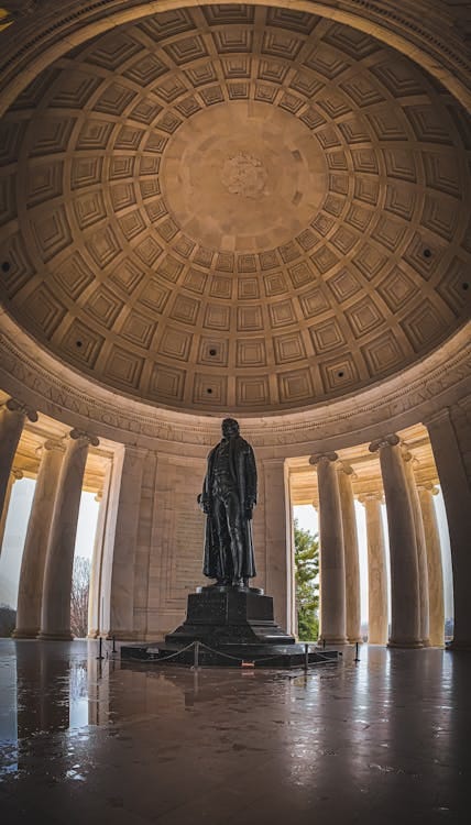 Free Explore the iconic interior of the Jefferson Memorial with its striking architecture and statue. Stock Photo