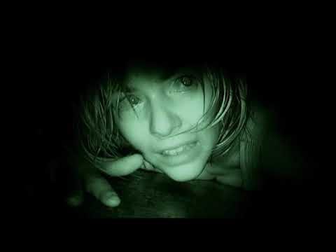 A shot from the ending sequence of the 2007 found footage movie, REC. We see a young woman in night-vision green, lying on the floor and talking directly into the camera.