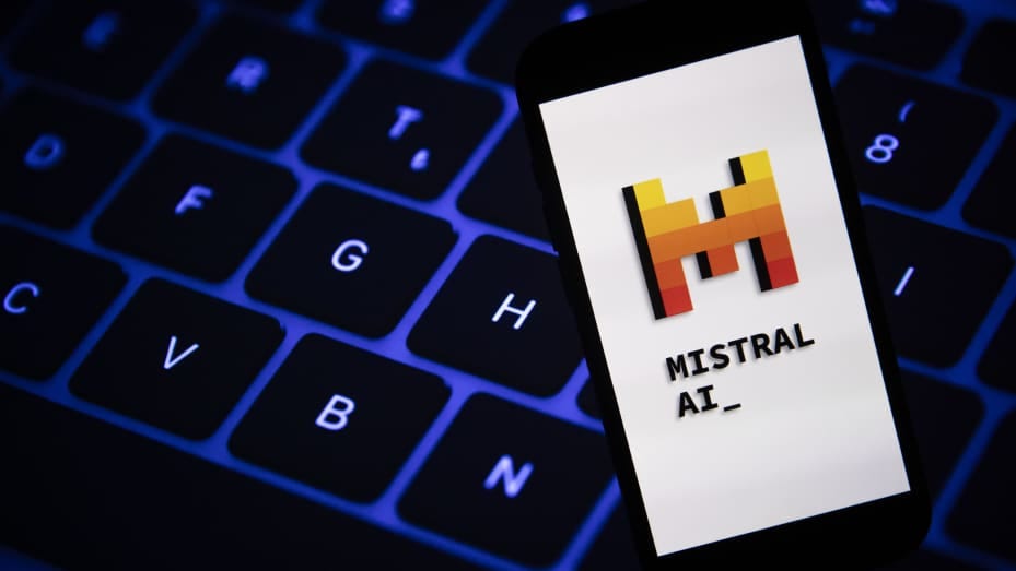 Mistral AI logo is displayed on a mobile phone screen.