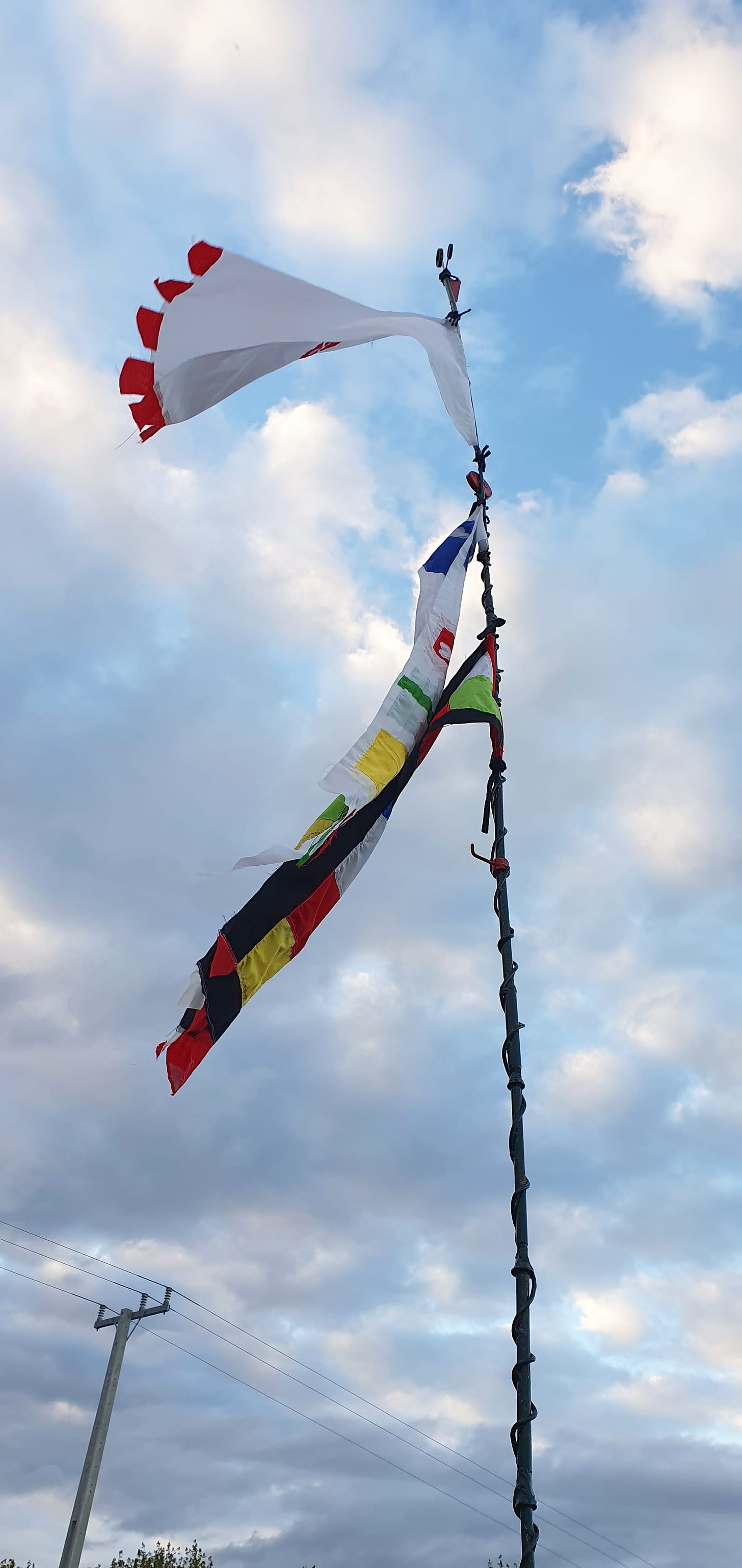 New flags trying to flying on top of 6meter new flagpole
