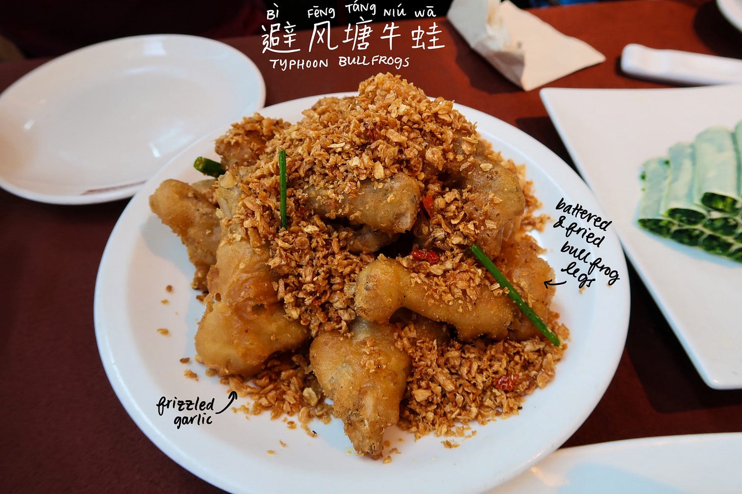 Typhoon shelter bullfrogs (避风塘牛蛙, bìfēngtáng niúwā)