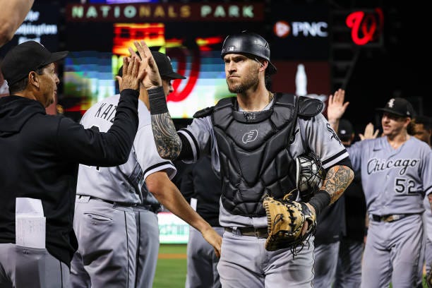 Yasmani Grandal of the Chicago White Sox celebrates with teammates after the game against the Washington Nationals at Nationals Park on September 18,...