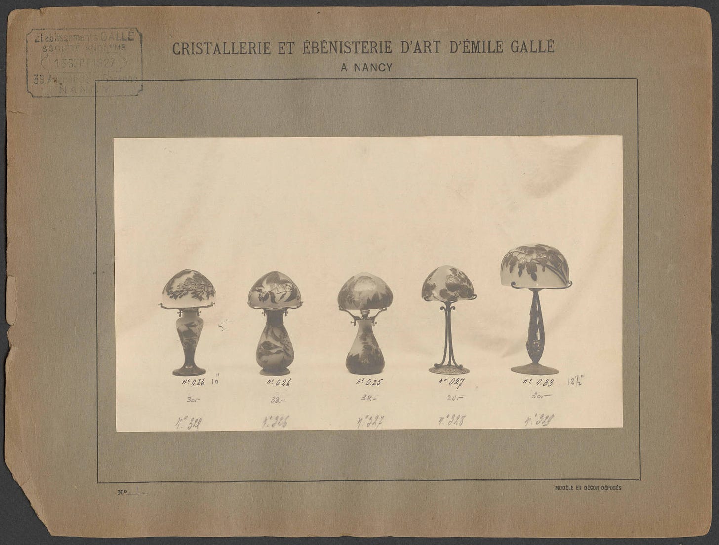 A sample of lamps, two of whom feature iron-wrought feet, from the Gallé 1927 sales album in the Rakow Library, Corning Museum of Glass.