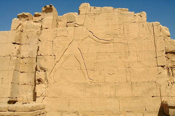 Amon-Ra Amon-Ra and symbols on the wall in Temple of Karnak, Egypt. amun ra stock pictures, royalty-free photos & images