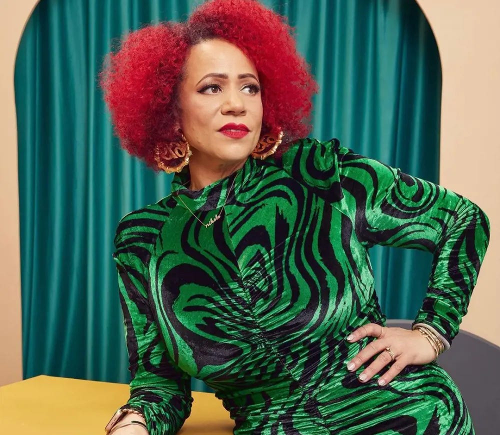Nikole in a  Lorenzo Serafini dress and red hair poses at the Sundance Film Festival in 2022
