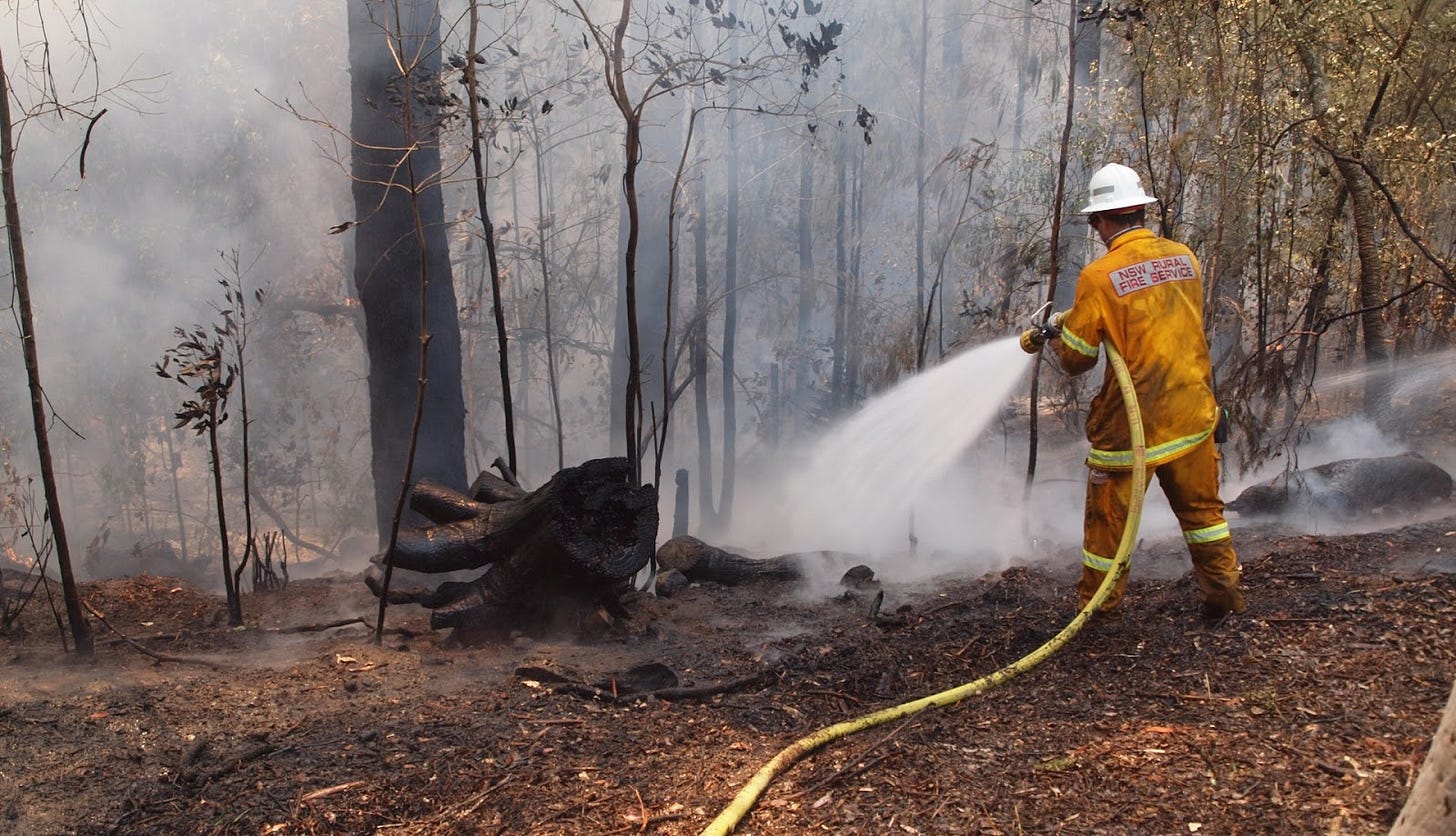 firefighter holding a hose firefighter holding a hose