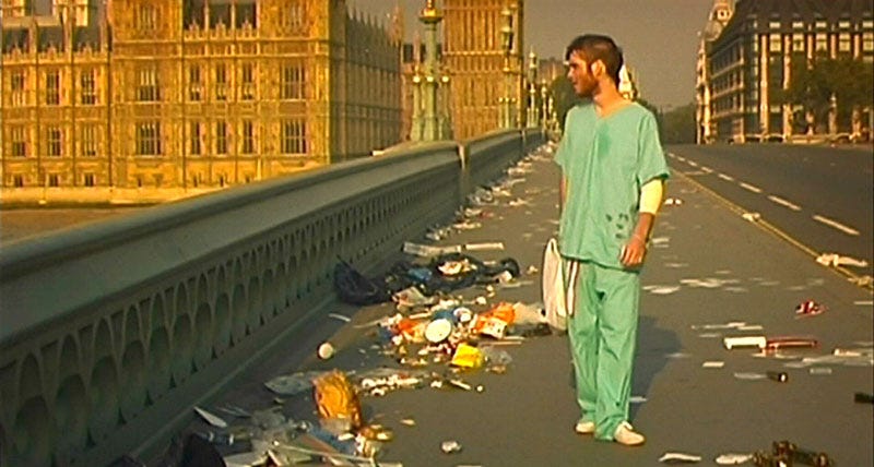 Cillian Murphy stands on a trash-strewn bridge in London. 28 Days Later.