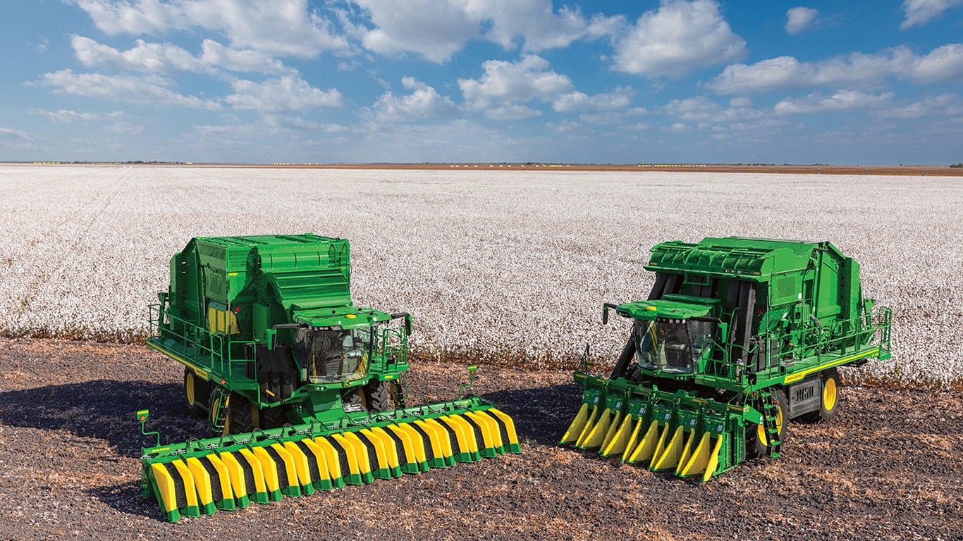 John Deere CP770 and CS770 in front of a cotton field