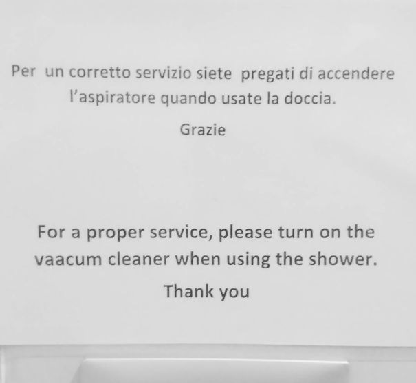 Wrong translated sign about shower and vacum cleaner