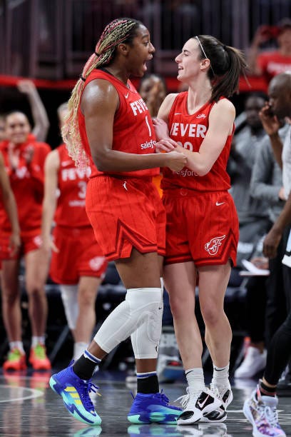 Aliyah Boston and Caitlin Clark of the Indiana Fever celebrate after defeating the Chicago Sky in the game at Gainbridge Fieldhouse on June 01, 2024...