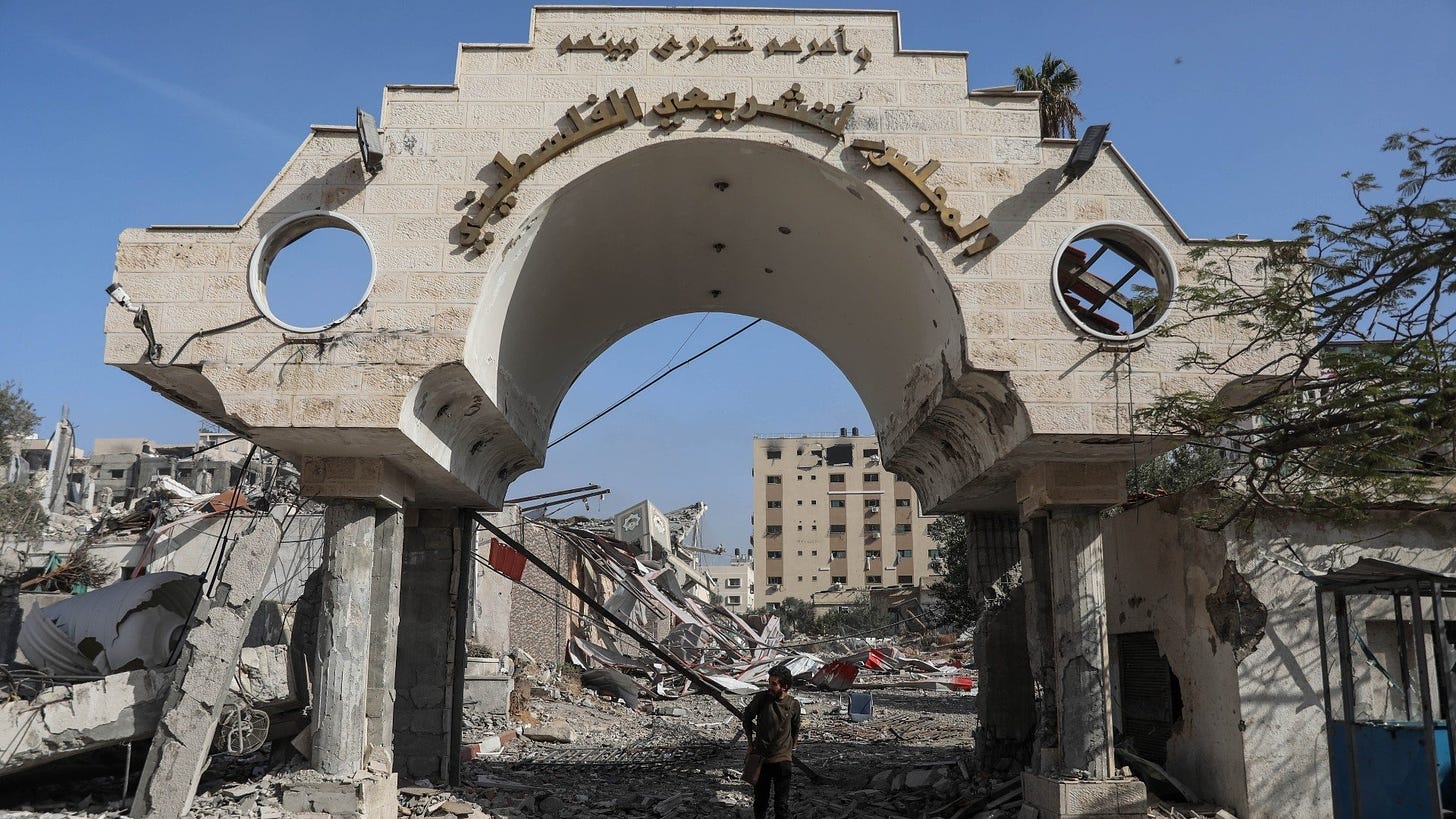 The gate of the damaged headquarters of the Palestinian legislative council in Gaza pictured on 24 November 2023 (MEE)