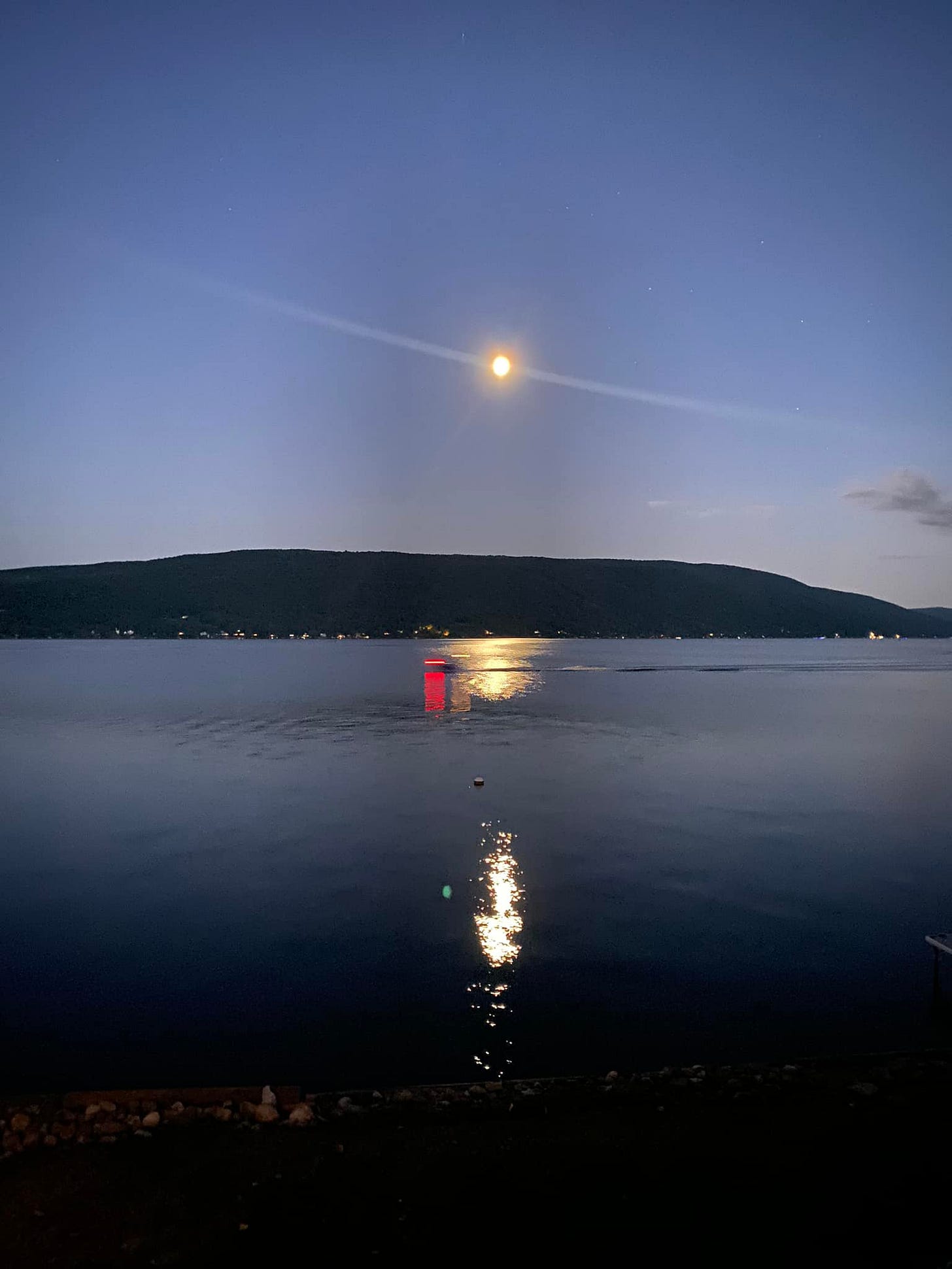 May be an image of eclipse and body of water