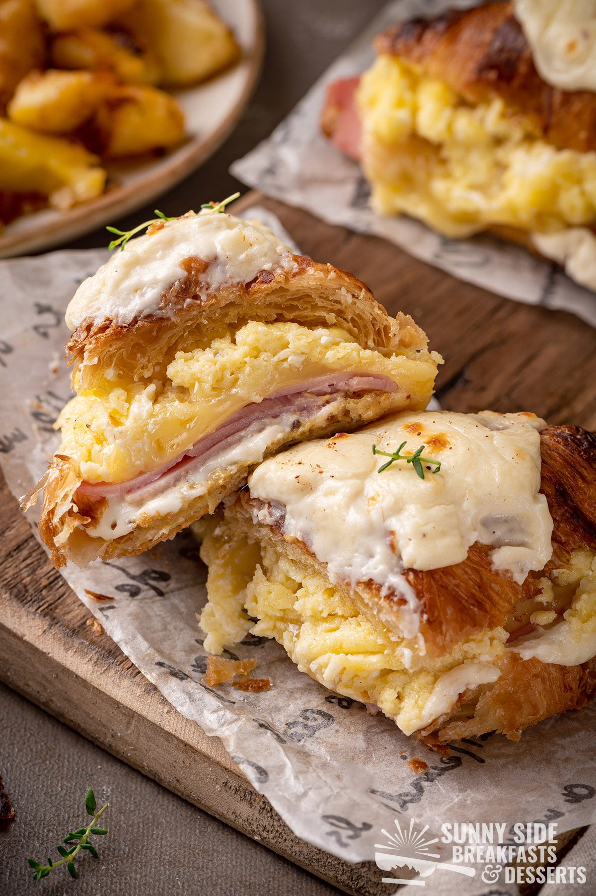 Croque madame made with croissants cut in half.