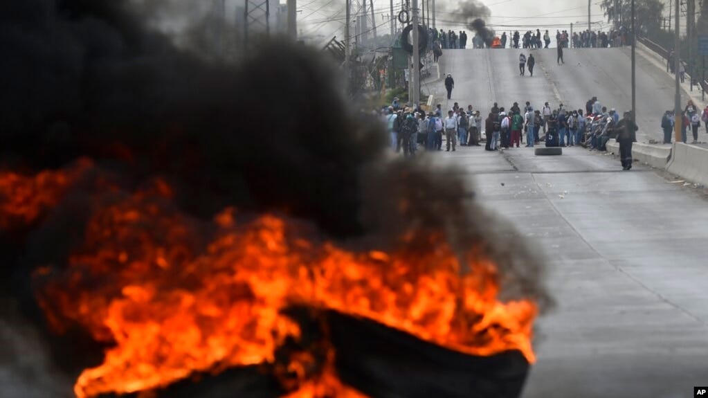 Demonstrators block a highway to protest Peruvian President Dina Boluarte's government and Congress in Arequipa, Peru, Jan. 19, 2023. 