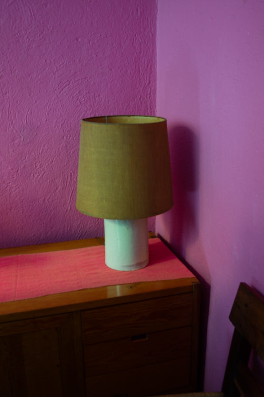 A lamp on a dresser

Description automatically generated