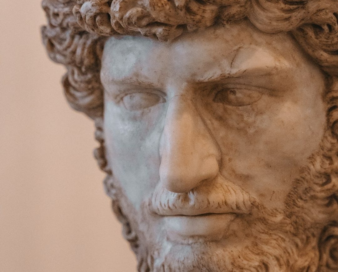 A statue of a man with curly hair and beard