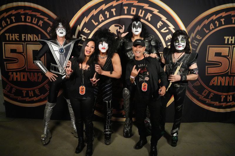 Johanna “Jojo” Atilano and Thierry Coup with the band KISS