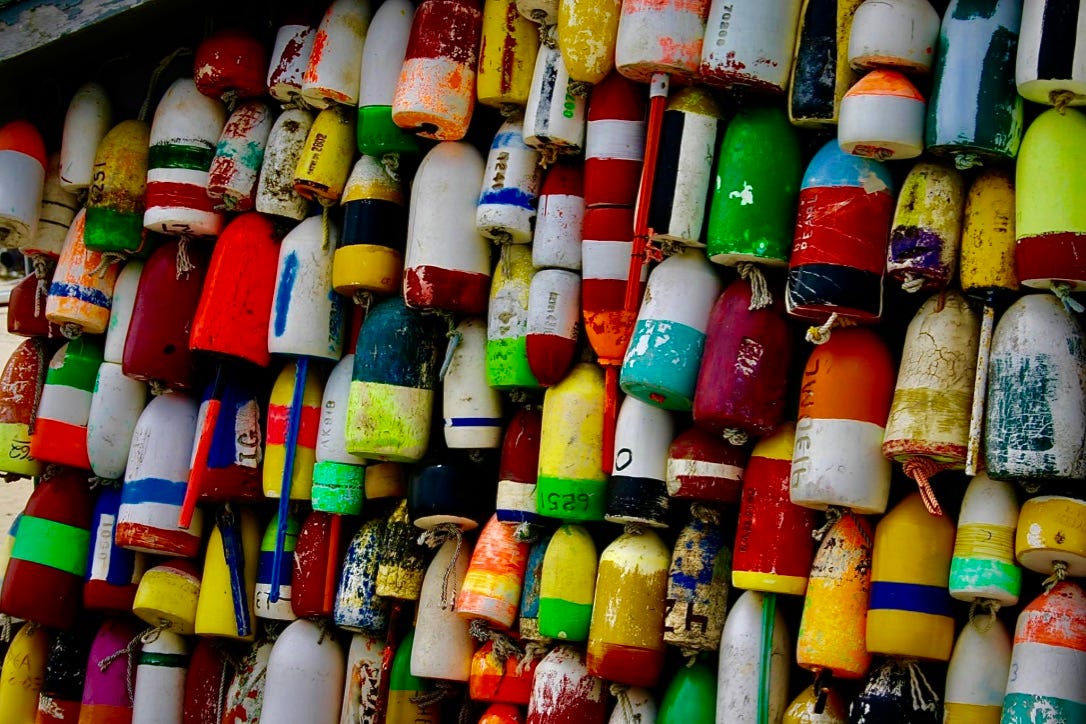A wall of colorful buoys

Description automatically generated