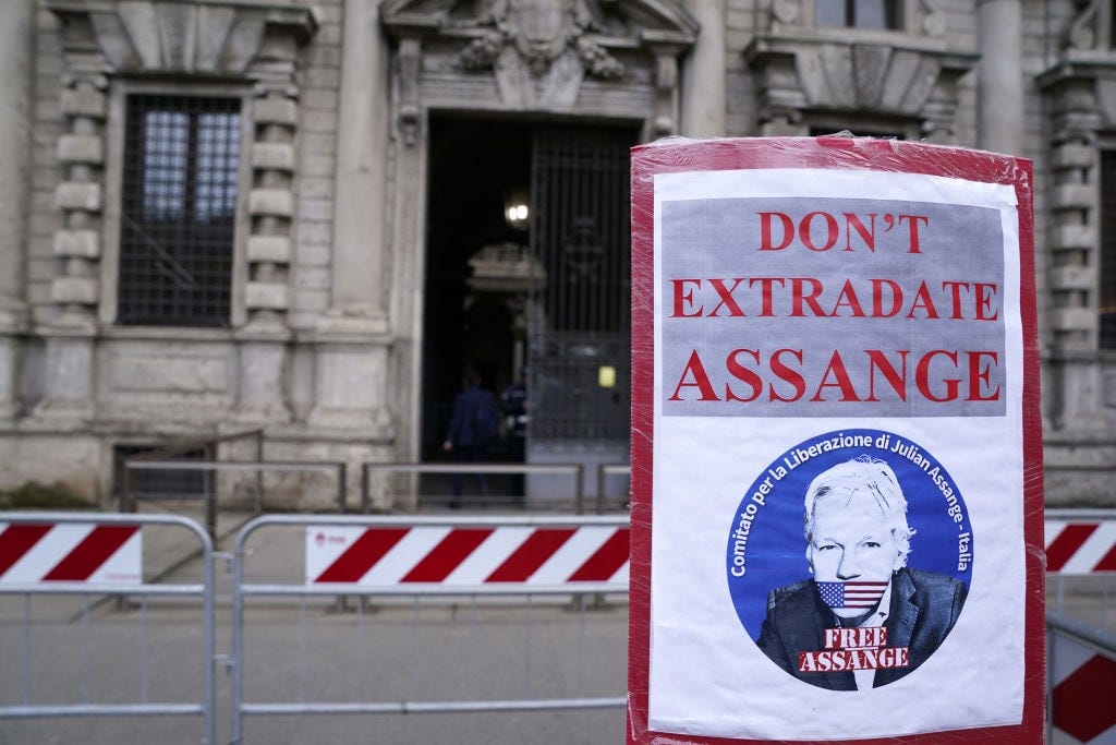 Italy Daily Life 2024MILAN, ITALY - MARCH 11: A banner is displayed in front of the Milan municipality building against the extradition of Julian Assange to the United States and to support honorary citizenship on March 11, 2024 in Milan, Italy. (Photo by Pier Marco Tacca/Getty Images)