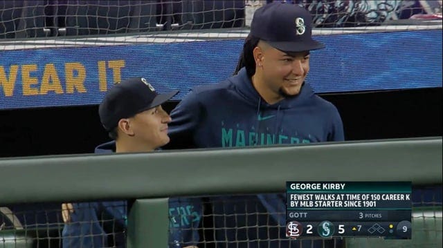 r/baseball - Luis Castillo gives George Kirby a hug after his start. George recorded his 150th career strikeout vs 23 total walks, tying a record set in 1901