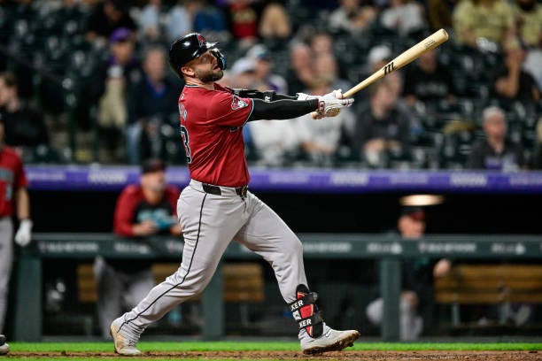 Christian Walker of the Arizona Diamondbacks hits an eighth inning solo home run against the Colorado Rockies at Coors Field on September 17, 2024 in...