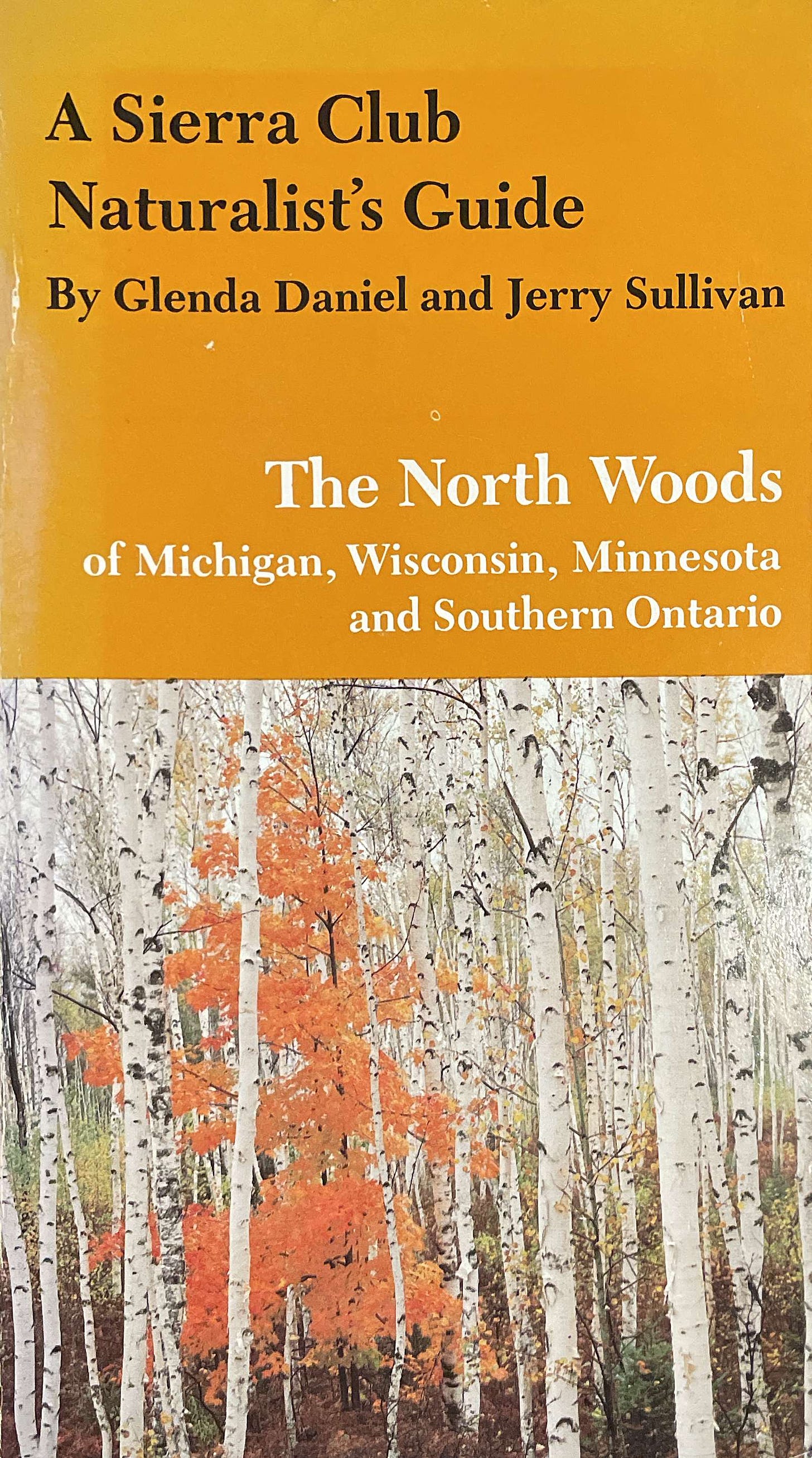 A book cover of the "The NOrth Woods of Michigan, Wisconsin,  Minnesota, and Southern Ontario