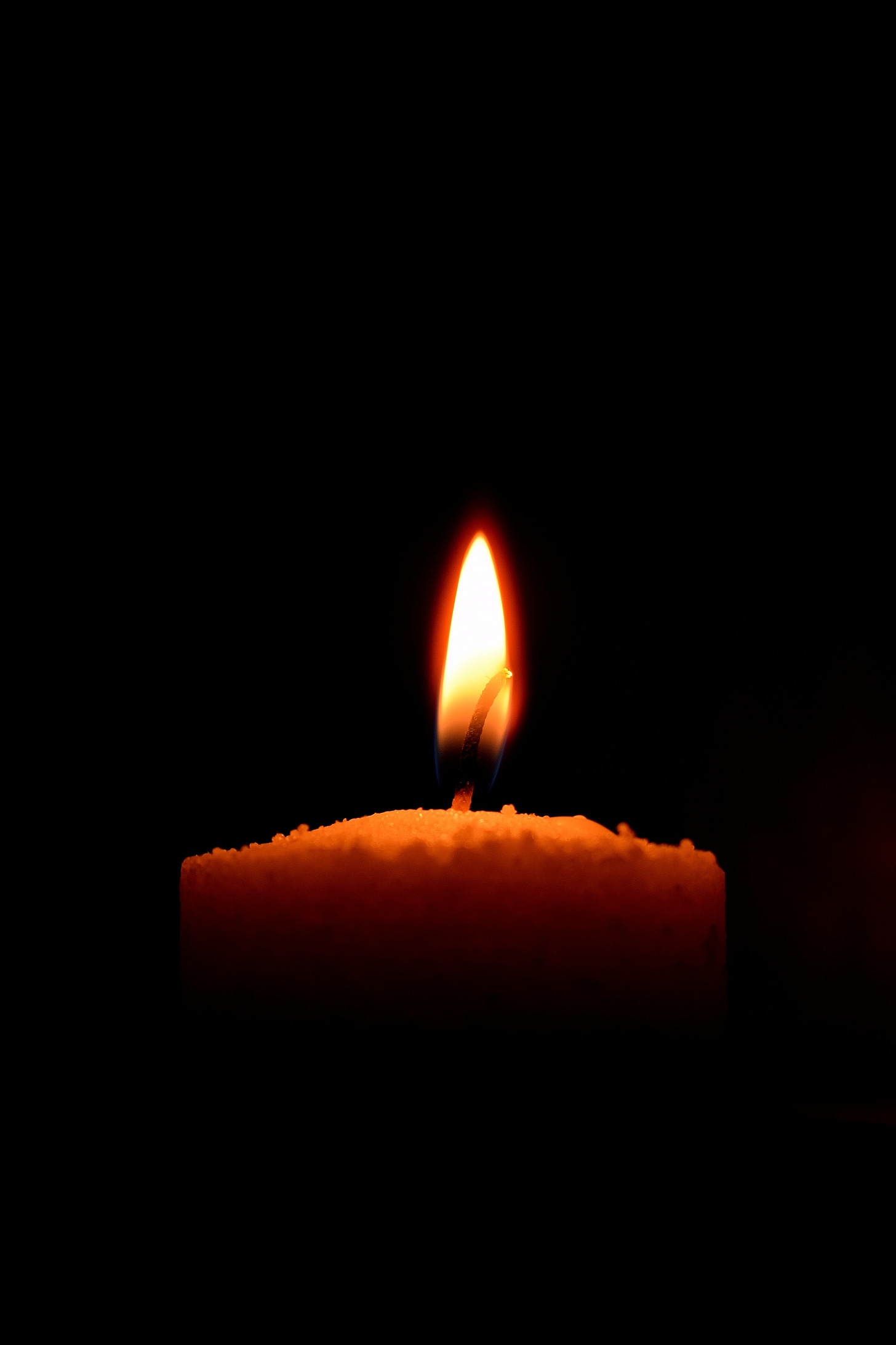 Candle on Black Background · Free Stock Photo